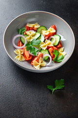 pasta salad vegetables and farfalle healthy meal food snack on the table copy space food background rustic top view