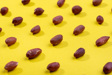 Pattern of peanuts. Fashionable sunny pattern of peanuts  on yellow background.