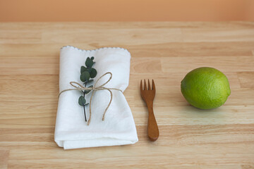 fresh green limes on a wooden background.