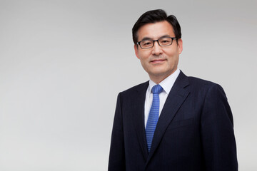 Portrait of a smiling middle-aged man in a suit