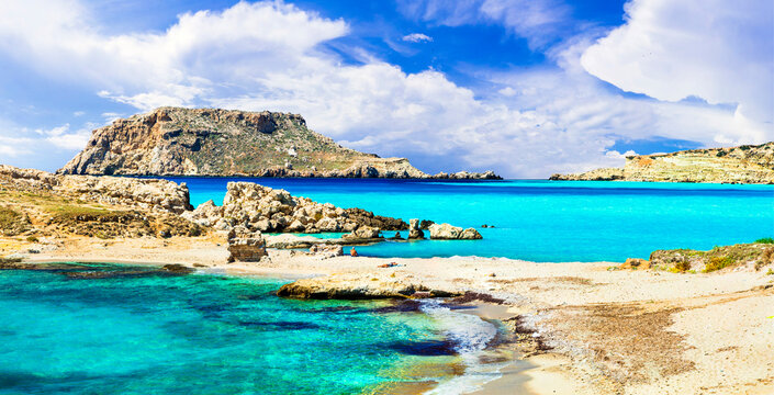 Lefkos Karpathos Greece panorama. Caribbean tropical water and rocky beach view. Greek islands Dodecanese. Turquoise sea landscape. Travel destination. High resolution 9K.