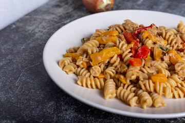 Pasta with peproni, tuna and onion. Typical dish of the Mediterranean diet