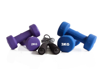 Skipping rope and dumbbells isolated on white background