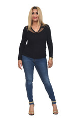 front view of a full portrait of a woman with jeans and heeled shoes on white background