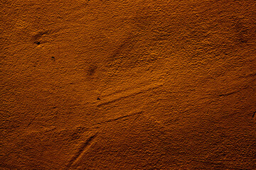 Copper colored wall texture background with textures of different shades of copper or bronze