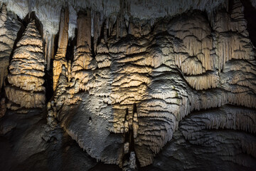Hughe cave with stalagmites and stalactites in the Karst area