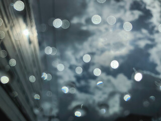 Blurred motion on mirror from raindrops