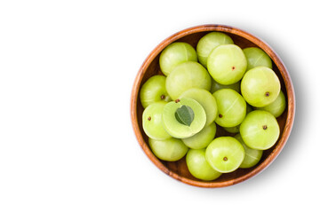 Closeup Indian gooseberry fruits ( phyllanthus emblica, amla ) in wooden bowl with green leaf and sliced isolated on white background. Top view. Flat lay.