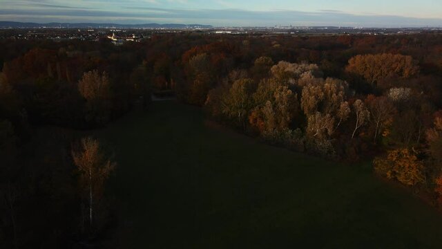 aerial view of a park in autumn sunset with Laxenburg and Vienna in the background