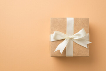 Top view photo of saint valentine's day decorations craft paper giftbox with white ribbon bow on...