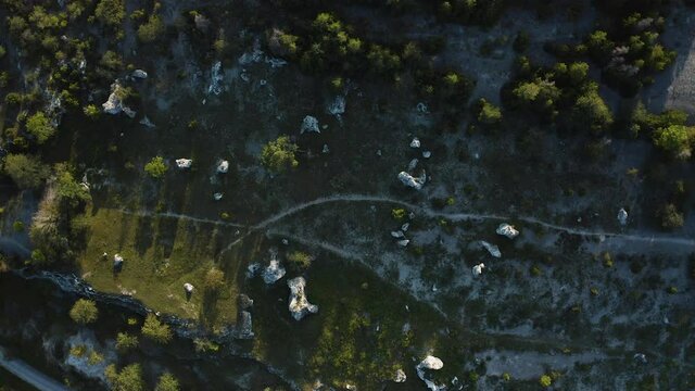 Top-down aerial shot over a collection of rauk stones on Gotland, Sweden
