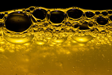 Yellow liquid with bubbles