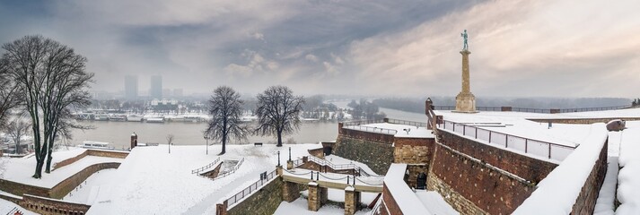 Winter panorama of Belgrade Kalemegdan fortress Danube and Sava rivers confluence and New Belgrade by day with snow