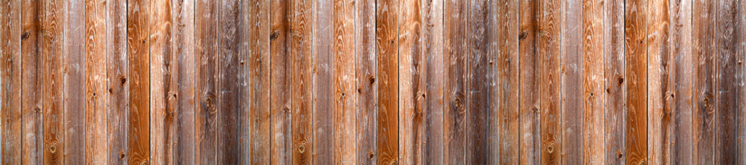 Fototapeta na wymiar Brown rich wooden background from horizontal planks