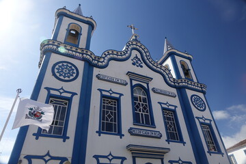 Shiny white and blue Igreja do Senhor Santo Cristo (Church of the Holy Christ) against the blue...