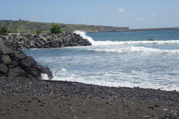 Rolling waves at the volcanic black beach of  Praia da Riviera on a sunny summer day, Praia da Vit&oacute;ria, Terceira, Azores, Portugal
