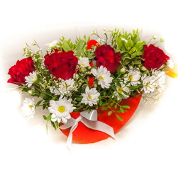 Fototapeta na wymiar Flowers - red roses and white chrysanthemums with decorative greenery close-up in a red wooden basket on a white background