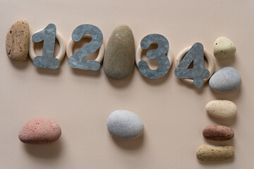 galvanized sheet metal numbers and stones on paper