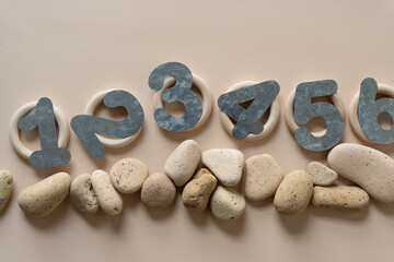 galvanized sheet metal numbers and stones on paper