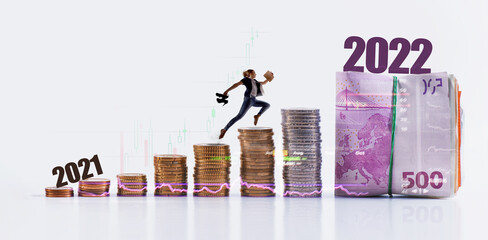 Silhouette woman jumping to money from 2021 to 2022 - Successful concept