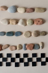 black chalk tiles and stones on paper