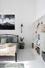Scandinavian style bedroom interior with furniture and poster