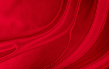 Black red satin dark fabric texture luxurious shiny that is abstract silk cloth background with patterns soft waves blur beautiful.