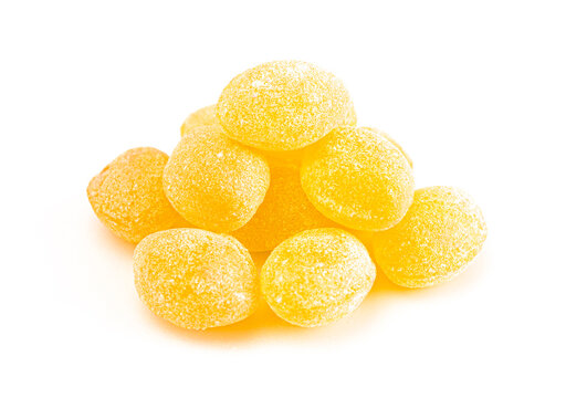 Yellow Old Fashioned Hard Candies on a White Background