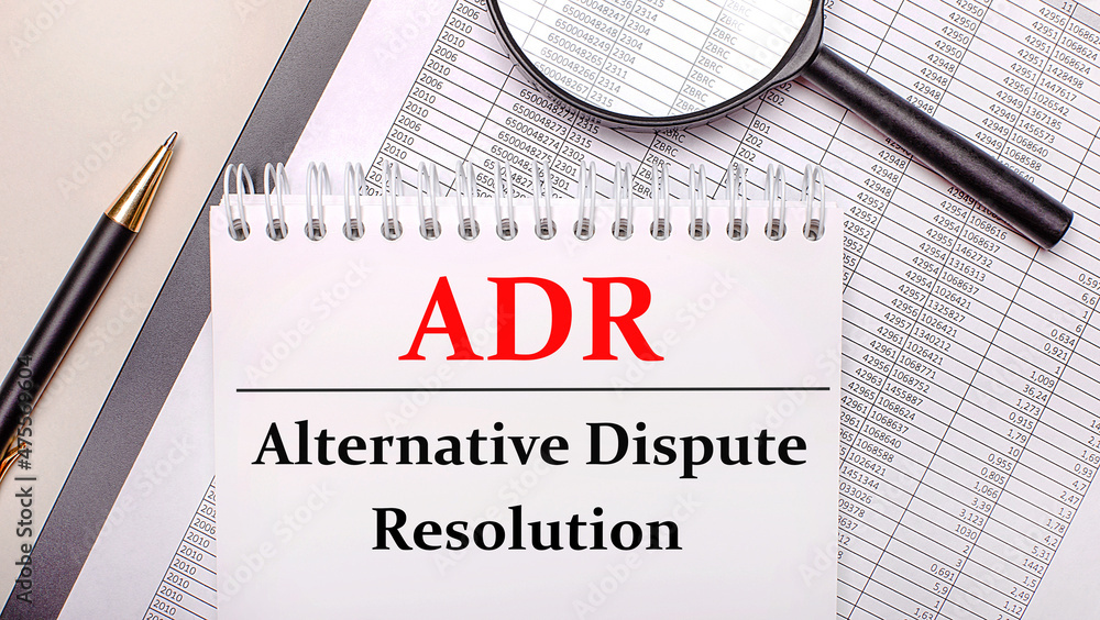 Poster desktop magnifier, reports, pen and notebook with text adr alternative dispute resolution. business 