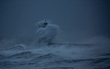 The gale force winds from Storm Arwen cause giant waves to batter the lighthouse and north pier...
