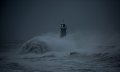 The gale force winds from Storm Arwen cause giant waves to batter the lighthouse and north pier...