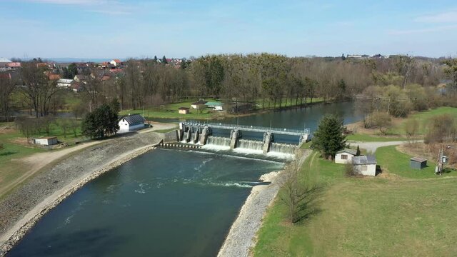Weir On Morava River, Hydro-electric Power Station, drone aerial video shot, regulated river Morava regulation flood protection measures large stones concrete, increasing banks, building flood valleys