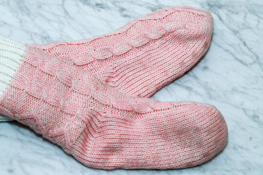 socks. Warm winter clothes for women. Cute pink  pair of socks. - Image