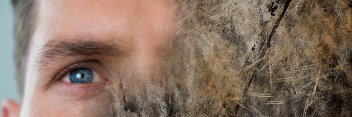 Fototapeta premium Composite image of close up of a male eye and grunge effect textured background