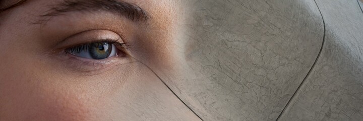 Obraz premium Composite image of close up of a female eye and grunge effect textured background