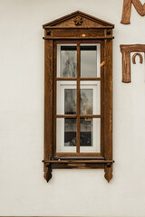 Obraz premium decorated windows and door in the textured wall of a small house