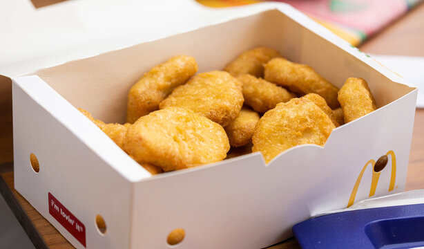 Stanislawice, Poland - May 30, 2021: Box of mcnuggets for children. Breaded chicken meat.