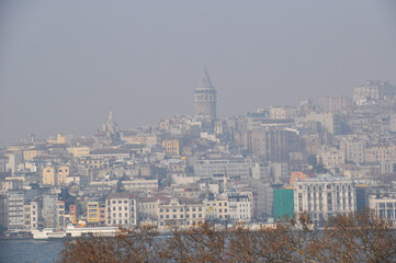 Fog in the city. Panoramic view of the city and Galata tower in Istanbul.