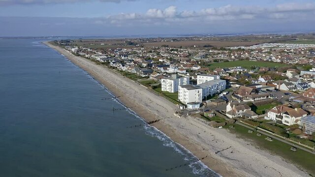 East Wittering seafront a popular resort for summer tourists in the summer and situated in West Sussex Southern England, Aerial.