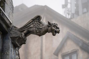 Gargoyle statue, chimeras, in the form of a medieval winged monster, from the royal castle in Bana...