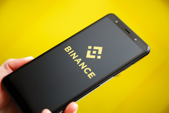 Ukraine, Odessa - October, 9 2021: Binance mobile app running at smartphone screen with Binance logo at background. Binance one of the world's leading cryptocurrency exchange and trading platform.
