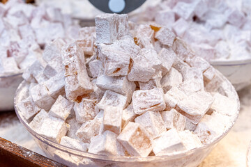 Close up of Turkish delight sweet treat with powdered sugar at Mahane Yehuda Market in Jerusalem, Israel
