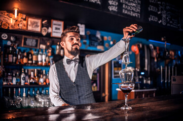 Barman mixes a cocktail on the beerhall