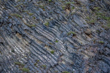Frozen lava volcanic rocks. The Black Beach near the town of Vik, Southern Iceland