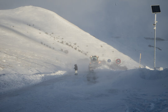 Snowplow clearing the mountain roads after the snow storm