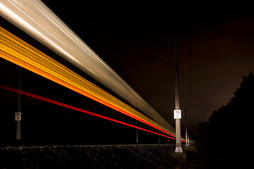 Night train light marks passing by 