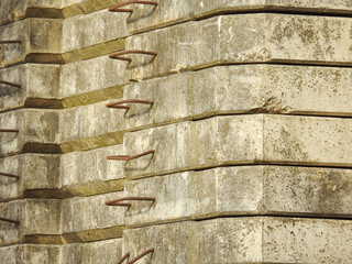 Perspective shot of a facing stone and metallic handles stuck in them.