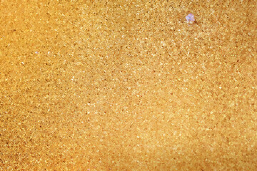 Glitter, macro gold realistic texture background