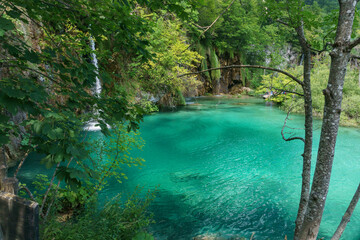 Peaceful waterfall with turquoise water pool in the Plitvice Lakes National Park, Croatia
