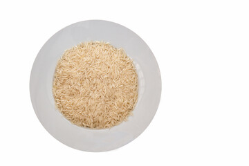 Raw basmati rice on white round plate, isolated on white background
